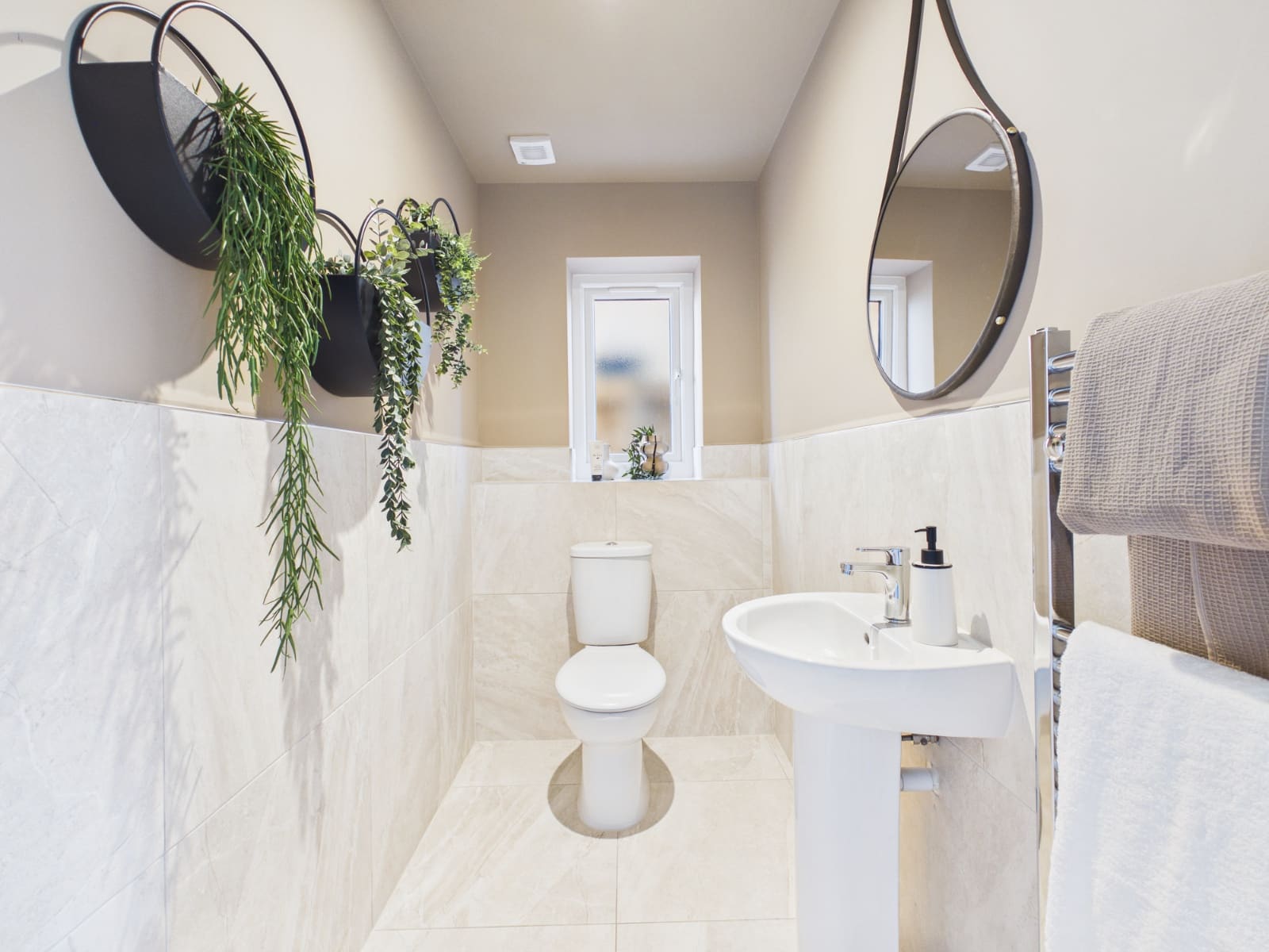 Show home bathroom with hanging plants